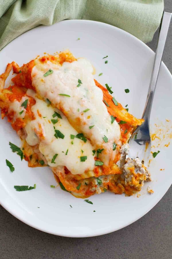 Taking a bite of Ground Beef Stuffed Manicotti