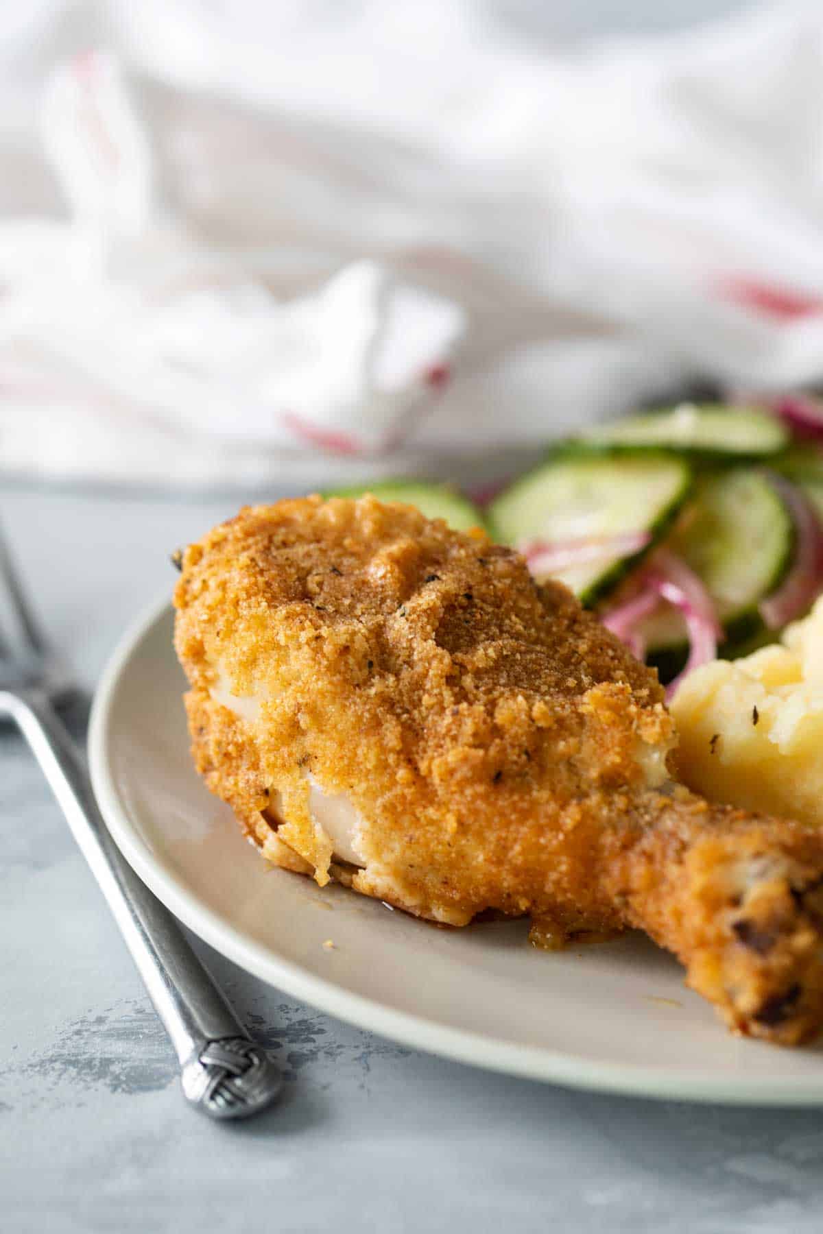 Oven Baked Chicken on a plate with sides