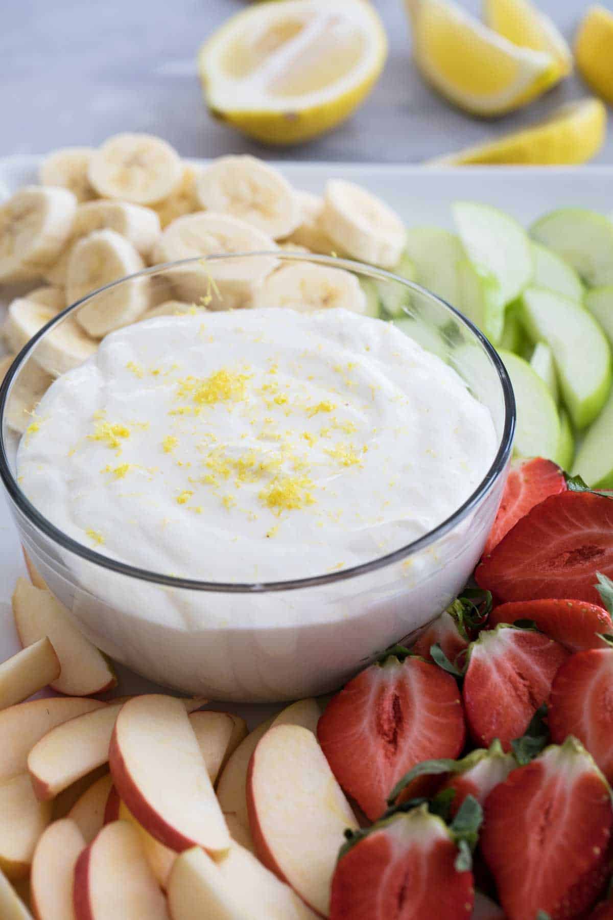 Lemon Cream Cheese Fruit Dip surrounded by fresh fruit