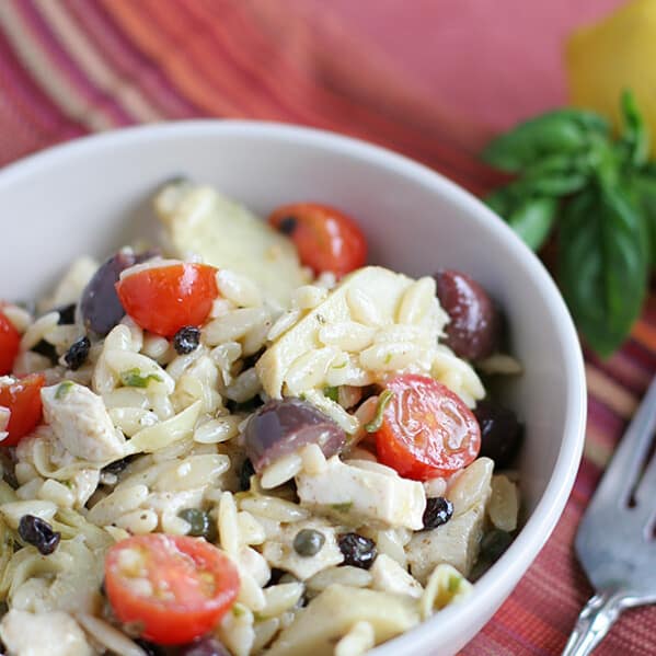 Mediterranean Pasta Salad in a bowl with a fork next to it.