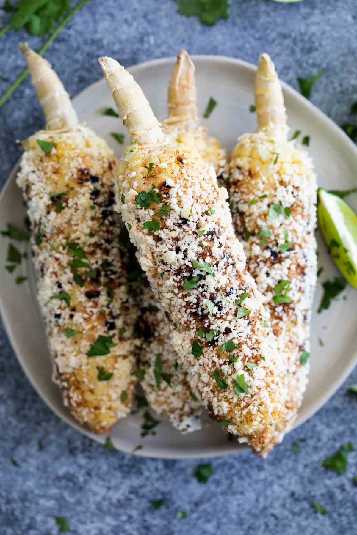 Elotes stacked on a plate