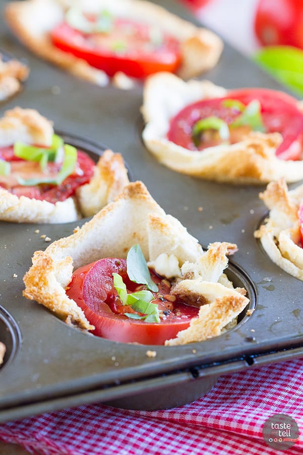 Mini tartlets filled with seasoned cream cheese, fresh mozzarella, tomato and topped with basil. These Mini Caprese Tartlets are the perfect end of summer appetizer or side dish!