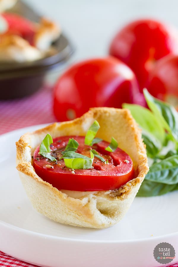 Mini tartlets filled with seasoned cream cheese, fresh mozzarella, tomato and topped with basil. These Mini Caprese Tartlets are the perfect end of summer appetizer or side dish!