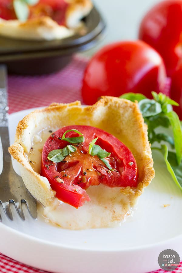 Mini tartlets filled with seasoned cream cheese, fresh mozzarella, tomato and topped with basil. These Mini Caprese Tartlets are the perfect end of summer appetizer or side dish!