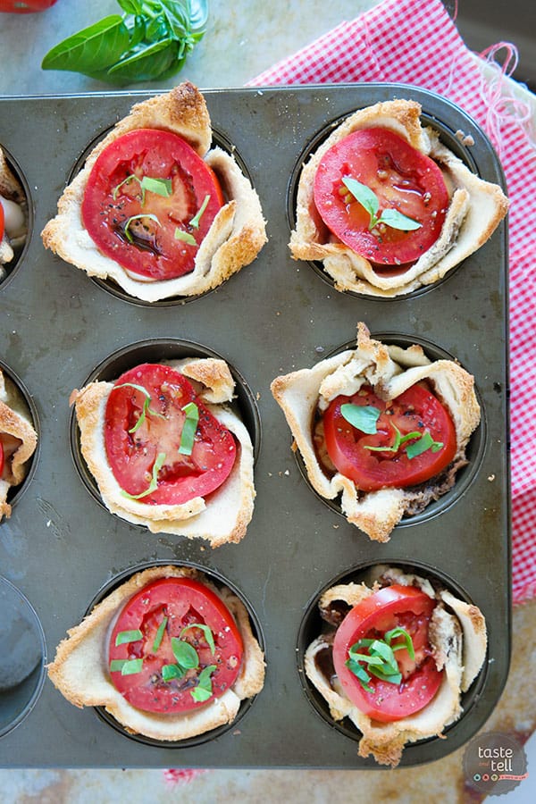 Mini tartlets filled with seasoned cream cheese, fresh mozzarella, tomato and topped with basil. These Mini Caprese Tartlets are the perfect end of summer appetizer or side dish!