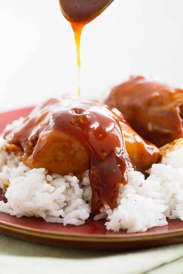 Slow Cooker Honey Garlic Chicken - chicken thighs are slow cooked in an easy honey garlic sauce, then served over rice. This proves that dinner doesn’t have to be complicated to be good!