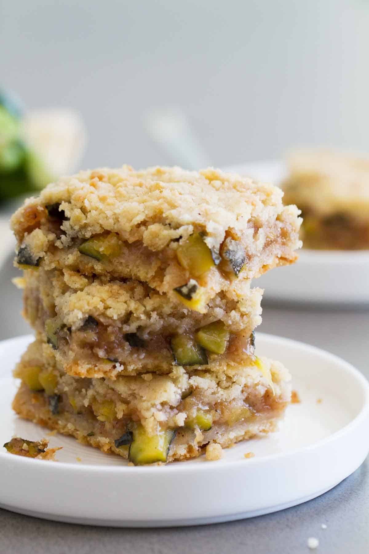 Three zucchini cobbler bars stacked on top of each other