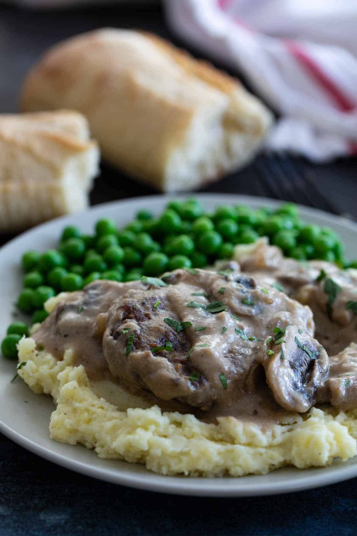 Salisbury Steak with Gravy on top of mashed potatoes.