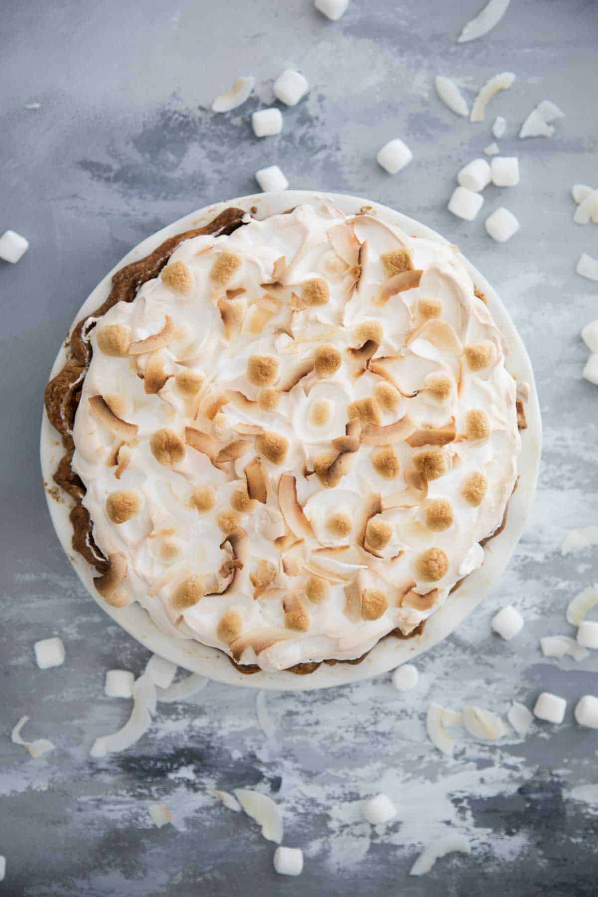 whole sweet potato pie with meringue shown from overhead