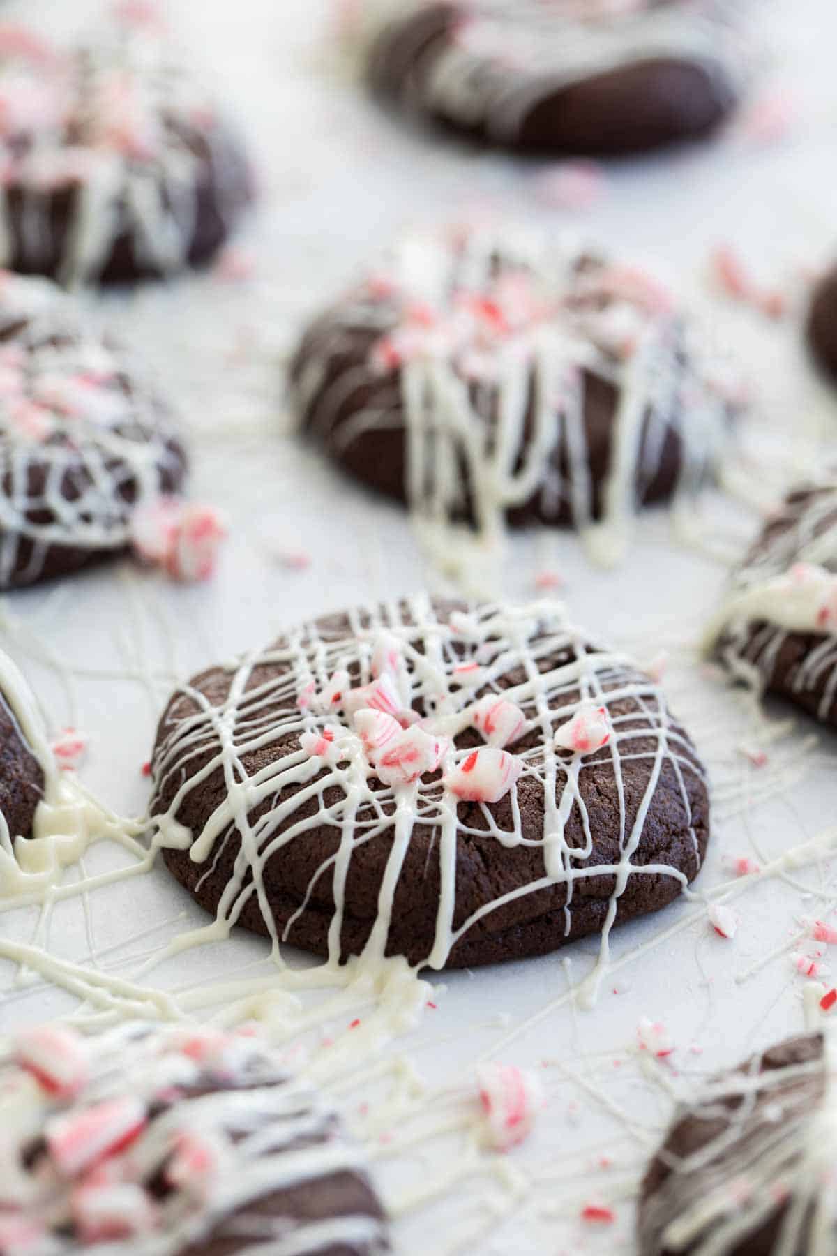 Chocolate Peppermint Cookies topped with white chocolate and candy canes