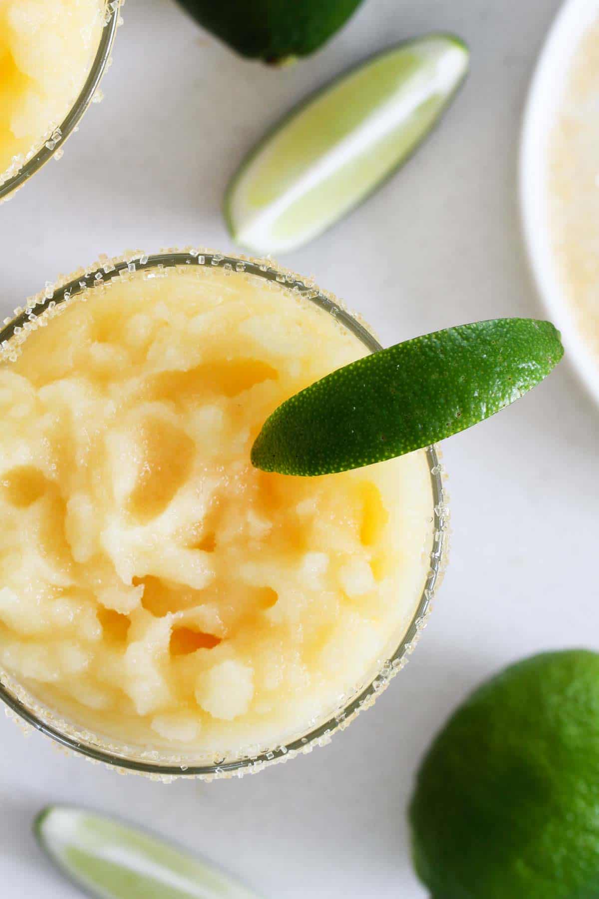Frozen Margaritas with no alcohol topped with limes