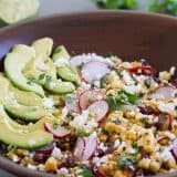 salad with grilled corn, black beans, avocado, and radishes
