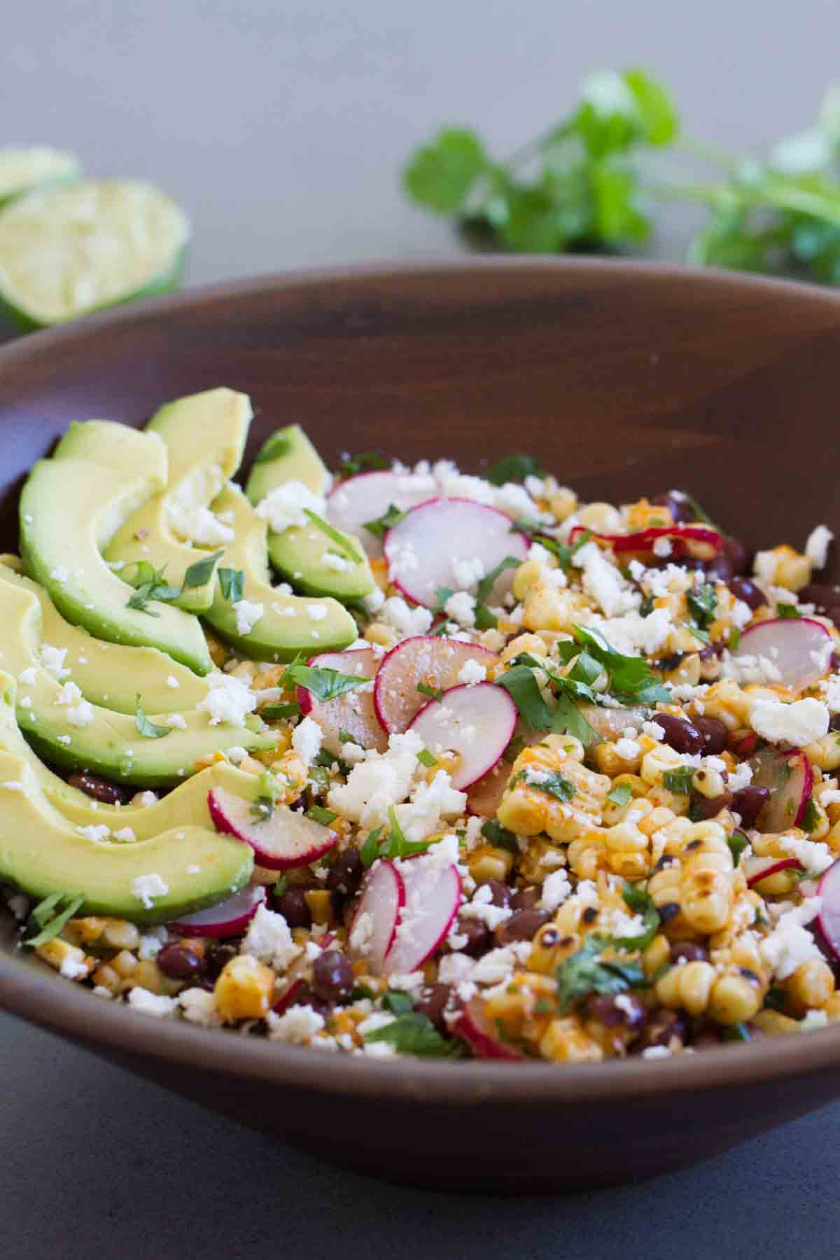 salad with grilled corn, black beans, avocado, and radishes