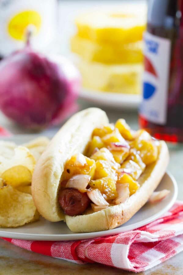 Hawaiian Hot Dog on a plate with chips