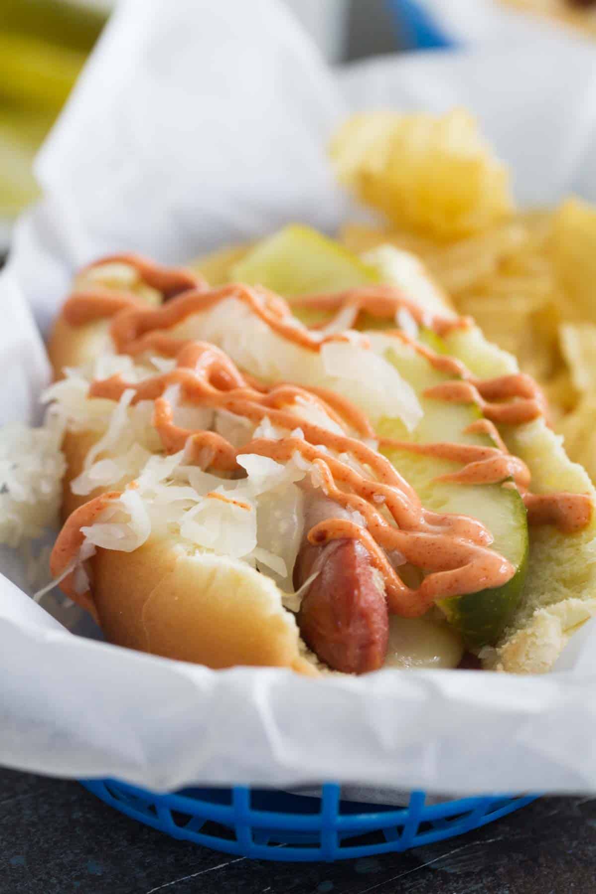 Hot dog with sauerkraut, pickle, and homemade Russian dressing