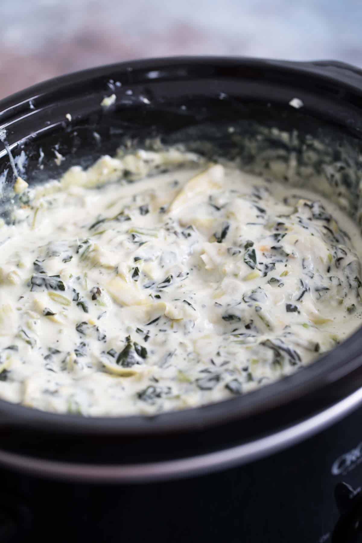 crockpot full of spinach artichoke dip