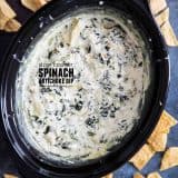crockpot spinach artichoke dip with text overlay