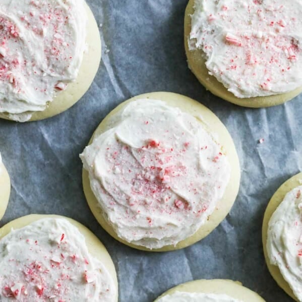 Soft Butter Sugar Cookies topped with buttercream and crushed candy canes.