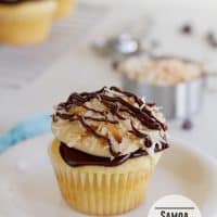 Samoa Cupcake - a yellow cupcake filled with caramel and topped with chocolate ganache, caramel buttercream and toasted coconut | www.tasteandtellblog.com