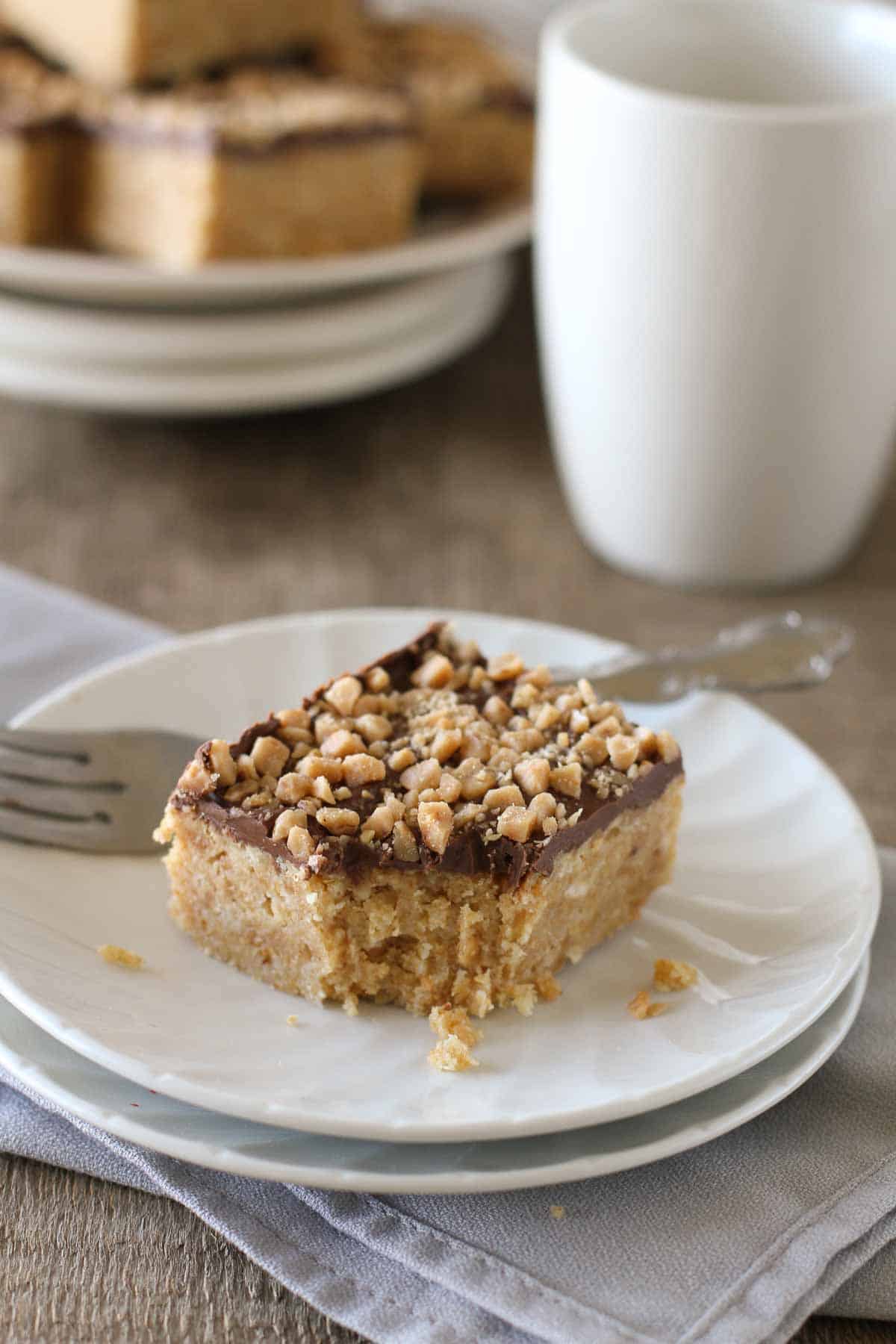Looking for an easy dessert? These Skor Squares have only 4 ingredients and are perfect for lovers of salty and sweet. Single skor square on a plate with a fork full taken from it.