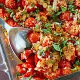 An easy and seasonal side dish using cherry tomatoes and fresh basil, this Tomato and Basil Bake is the perfect late summer side dish.