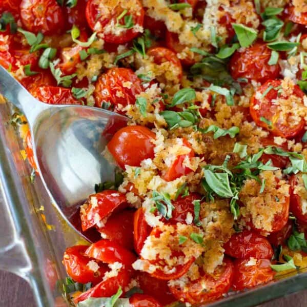 An easy and seasonal side dish using cherry tomatoes and fresh basil, this Tomato and Basil Bake is the perfect late summer side dish.