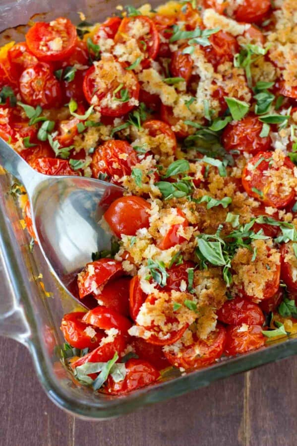 An easy and seasonal side dish using cherry tomatoes and fresh basil, this Tomato and Basil Bake is the perfect late summer side dish.