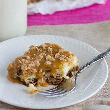 Caramel Cookie Cheesecake Bar with a bite taken from it.