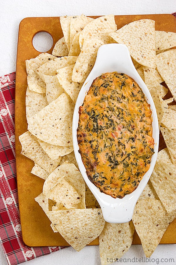 This easy, hot, cheesy Dump and Stir Mexican Dip is perfect for any group gathering. It only takes minutes to pull together before baking it off until hot and bubbly.