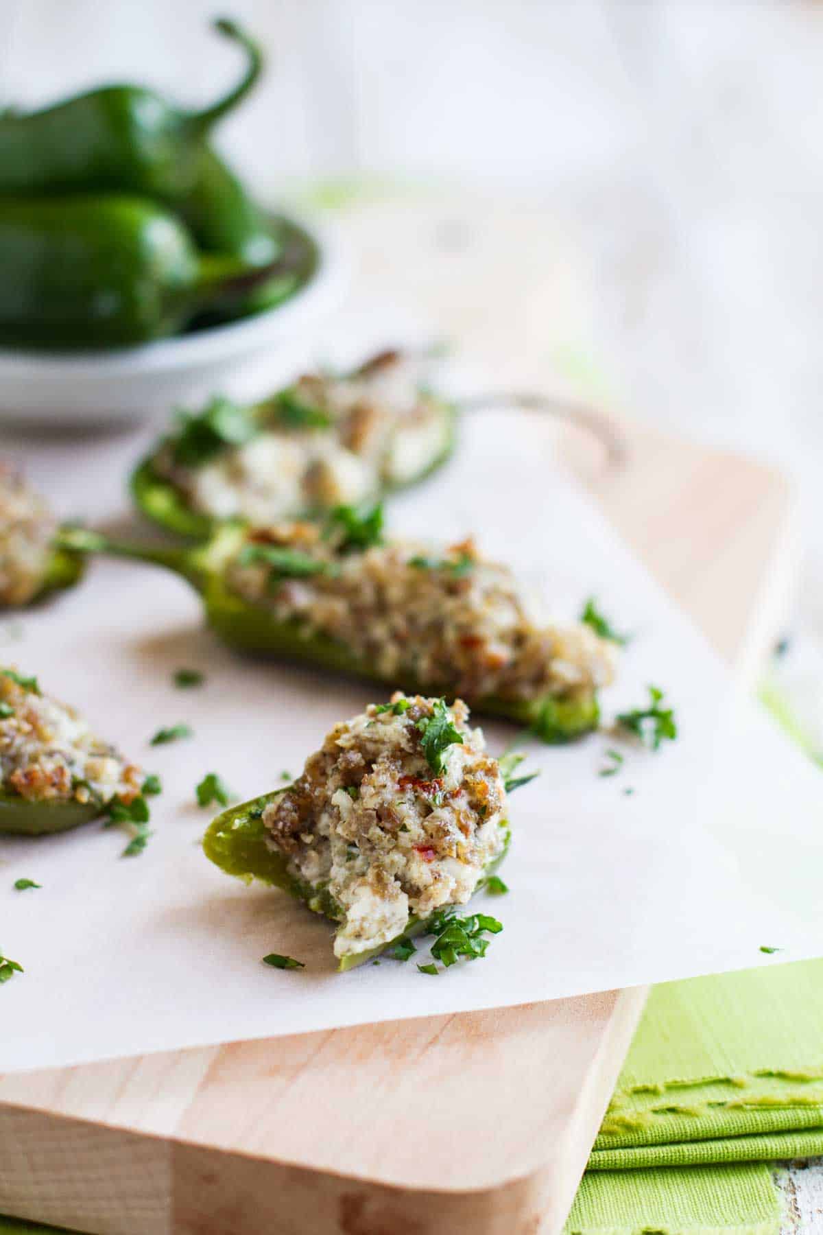Cream Cheese Stuffed Jalapenos with a bite taken from one.