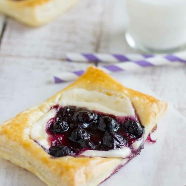 These Blueberry Cream Cheese Pastries have puff pastry that is topped with sweetened cream cheese and a blueberry mixture for a perfectly decadent breakfast treat.
