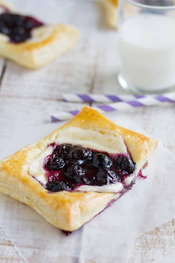 These Blueberry Cream Cheese Pastries have puff pastry that is topped with sweetened cream cheese and a blueberry mixture for a perfectly decadent breakfast treat.