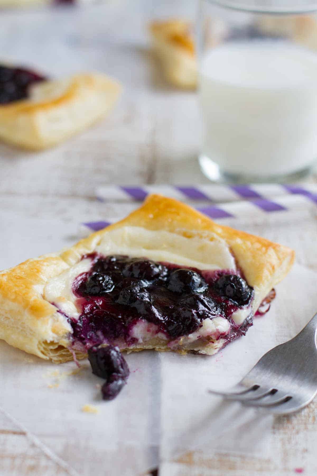 Puff Pastry Danish topped with sweetened cream cheese and blueberries.