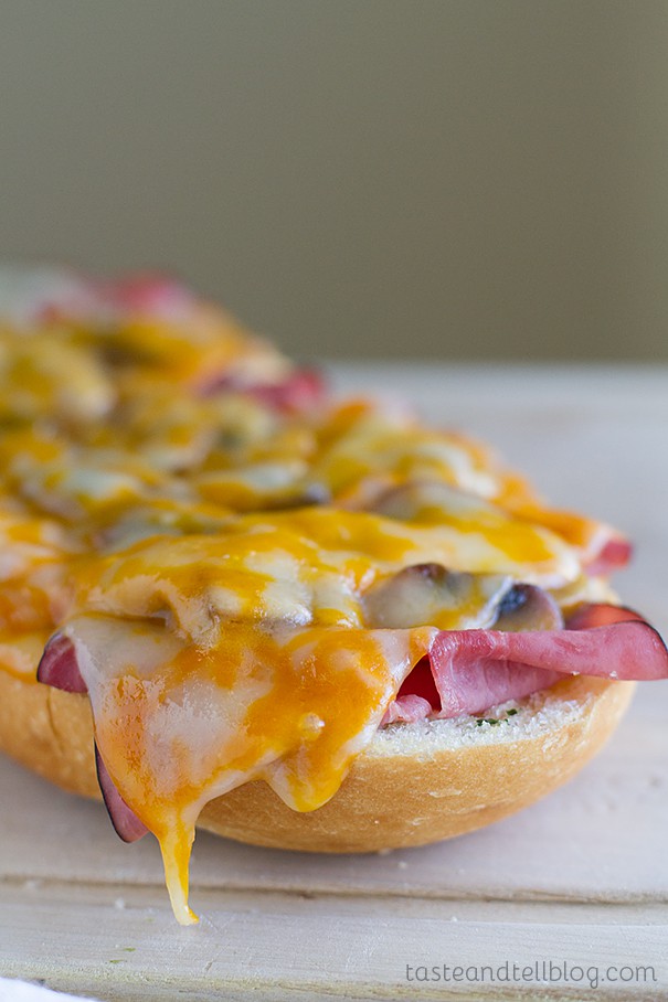 Easy Garlic Roast Beef Sandwich with metled cheese on top.