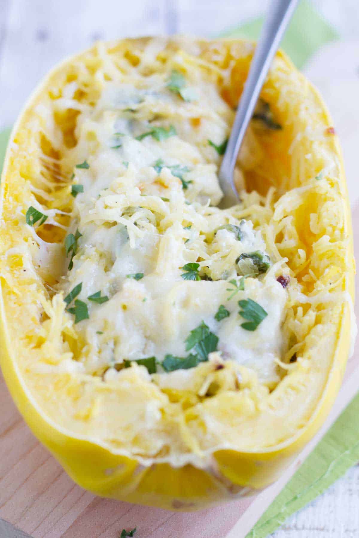 Spaghetti squash filled with spinach, artichokes, and cheese.