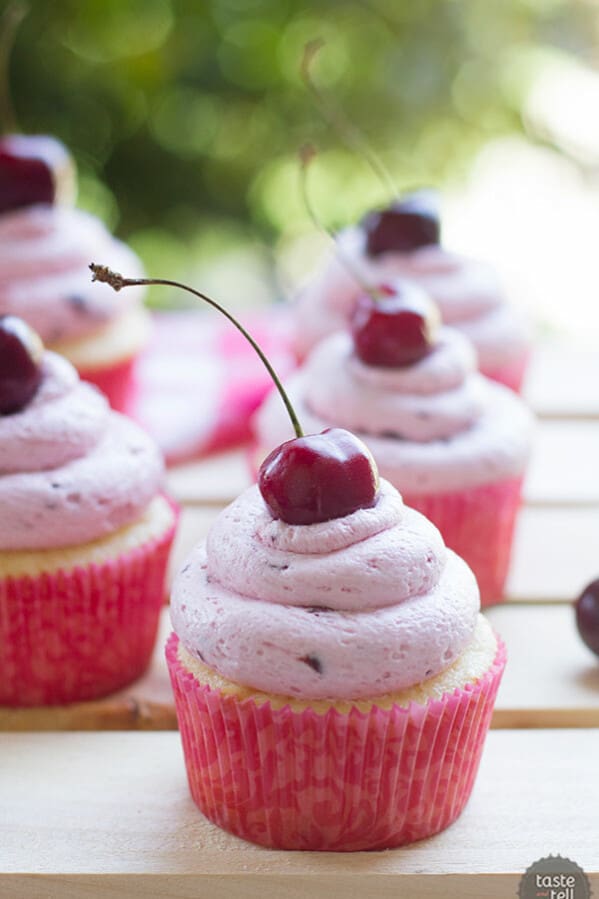 Moist almond cupcakes made from scratch are topped with a light and fluffy cherry buttercream, made from fresh cherries.