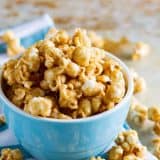 Baked Caramel Popcorn in a blue bowl