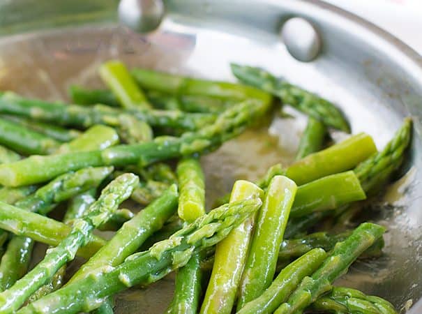 A simple side dish, this sauteed asparagus recipe is finished off with a maple syrup and mustard drizzle.