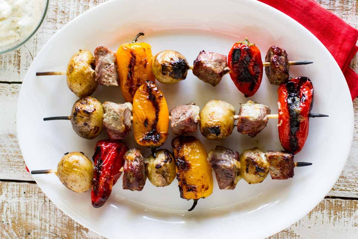 picture of kabobs with steak, potatoes, and peppers