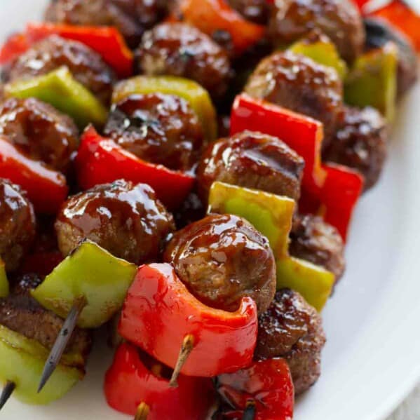 Sweet and Sour Meatball Skewers stacked on a plate