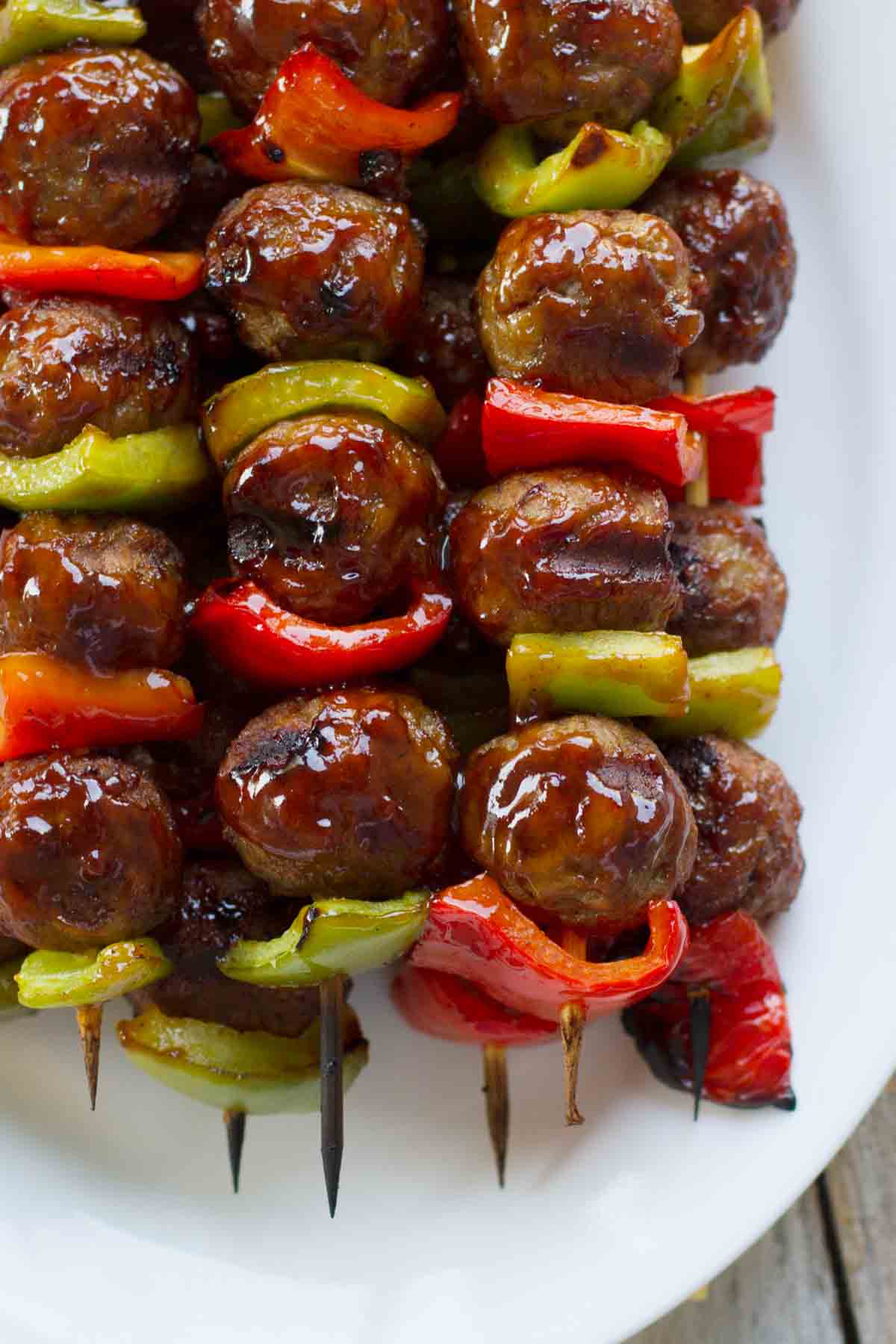 skewers with meatballs and peppers brushed with sweet and sour sauce