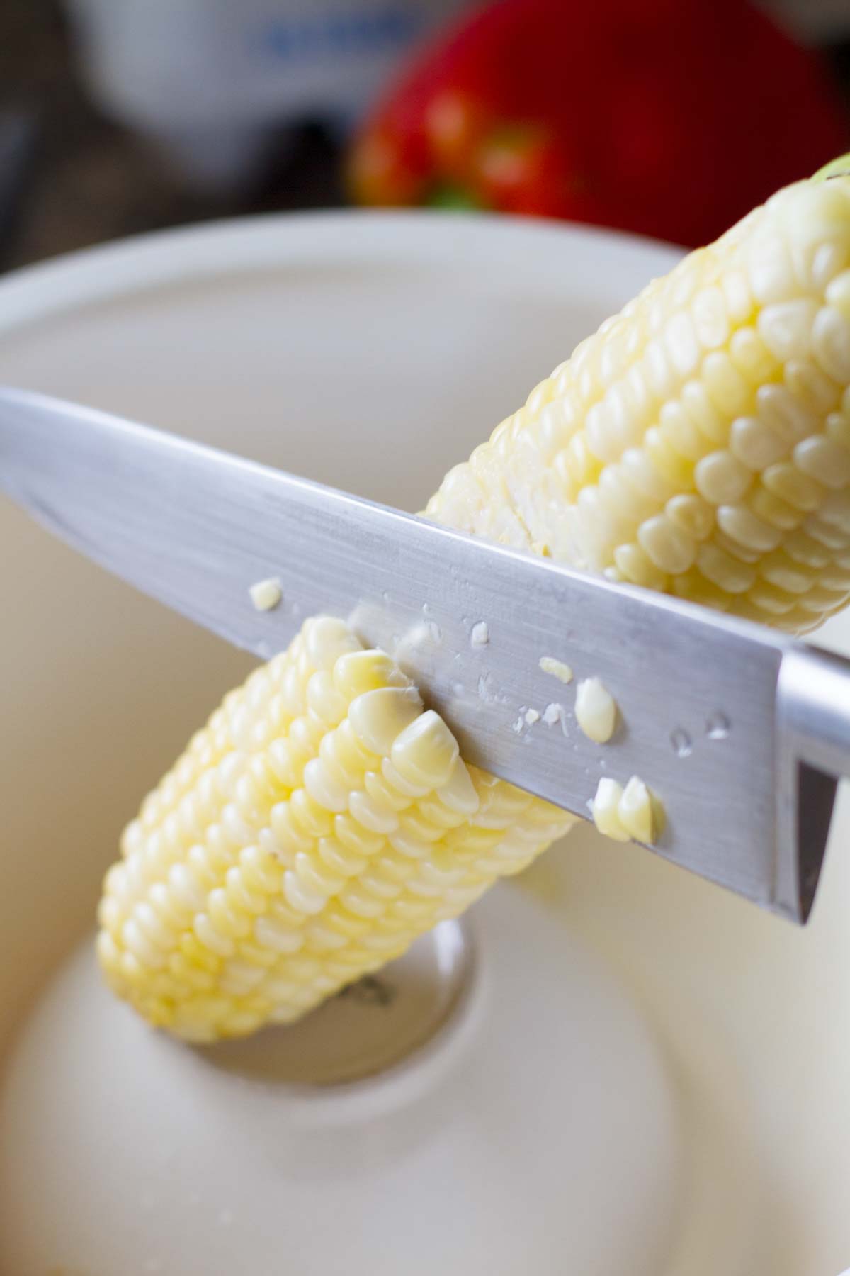 cutting corn off of the cob