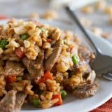 This Asian-inspired Rice and Beef Stir Fry Recipe has rice, beef, vegetables and a homemade stir fry sauce that combine to form a comforting dinner filled with flavor.