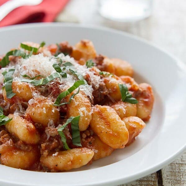 Gnocchi with Meat Sauce - This easy stove-top dinner brings together potato gnocchi with a hearty meat sauce for an easy dinner recipe that the whole family will love.