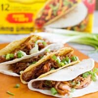 Honey Garlic Chicken Tacos - Chicken thighs are slow cooked in a honey, soy and garlic mixture, then shredded for a fun Taco Tuesday.