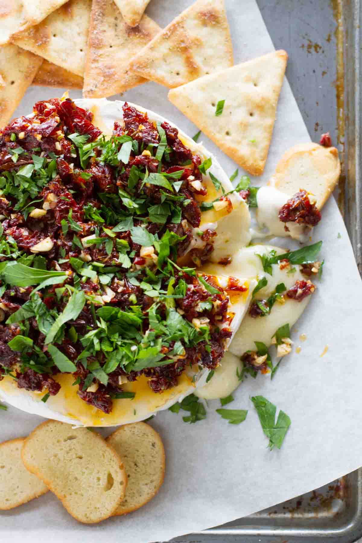 Easy Baked Brie Recipe topped with Sun-Dried Tomatoes