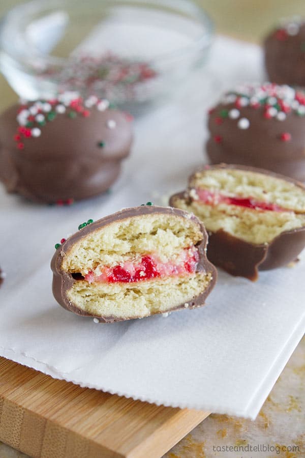 Chocolate Cherry Sandwich Cookies - Vanilla wafers are filled with a cherry cream cheese mixture, then dipped in chocolate in these fun cookies.