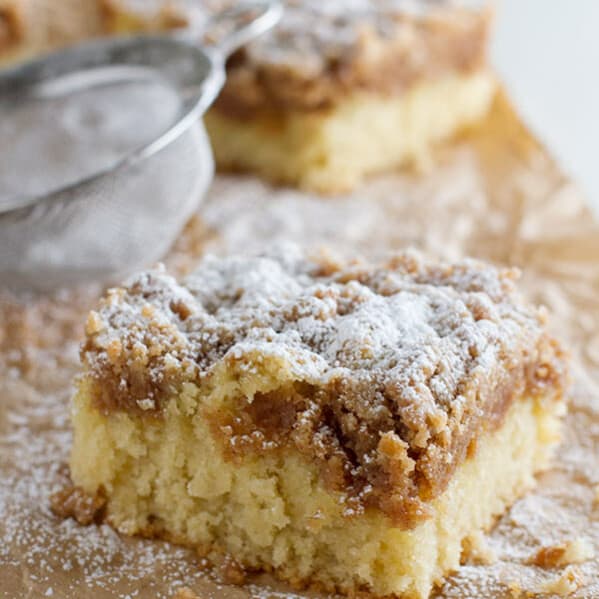 This Crumb Cake Recipe has a moist cake that is topped with a thick layer of crumb topping. This is the BEST crumb cake recipe!