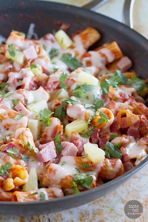 Keep dishes to a minimum with this easy one pan pasta with the flavors of a Hawaiian pizza - ham, bacon, pineapple and gooey cheese.