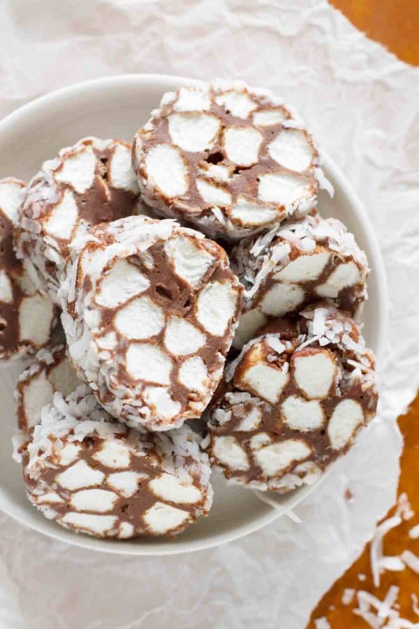 An old fashioned homemade candy - this Shaggy Dog Candy Recipe is perfect for the Christmas plate! Chocolate and marshmallows are rolled in coconut in this decadent treat.